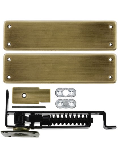 Heavy Duty Swinging Door Floor Hinge With Solid Brass Cover Plates in Antique Brass.